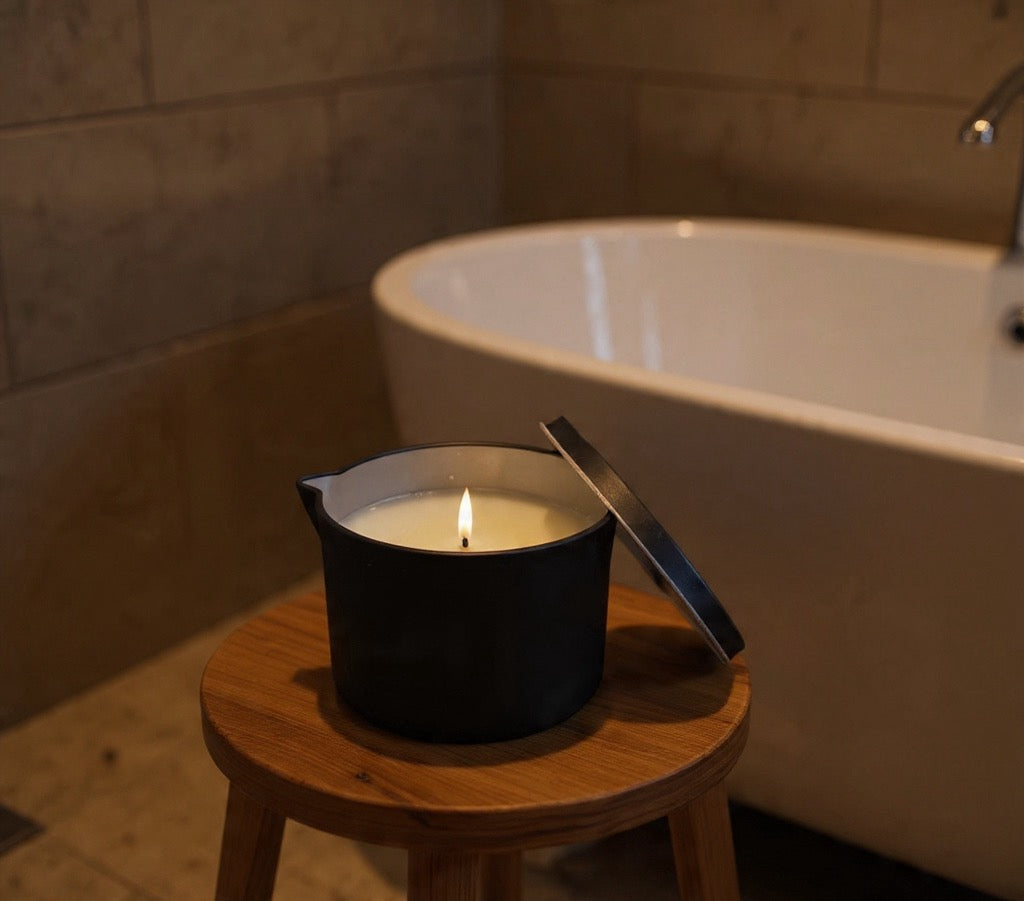 Autahi Body Serum candle in Black tin with spout.