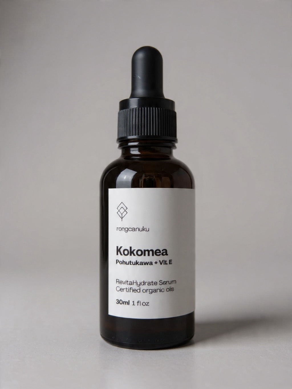 30ml black dropper bottle of Kokomea Face Oil