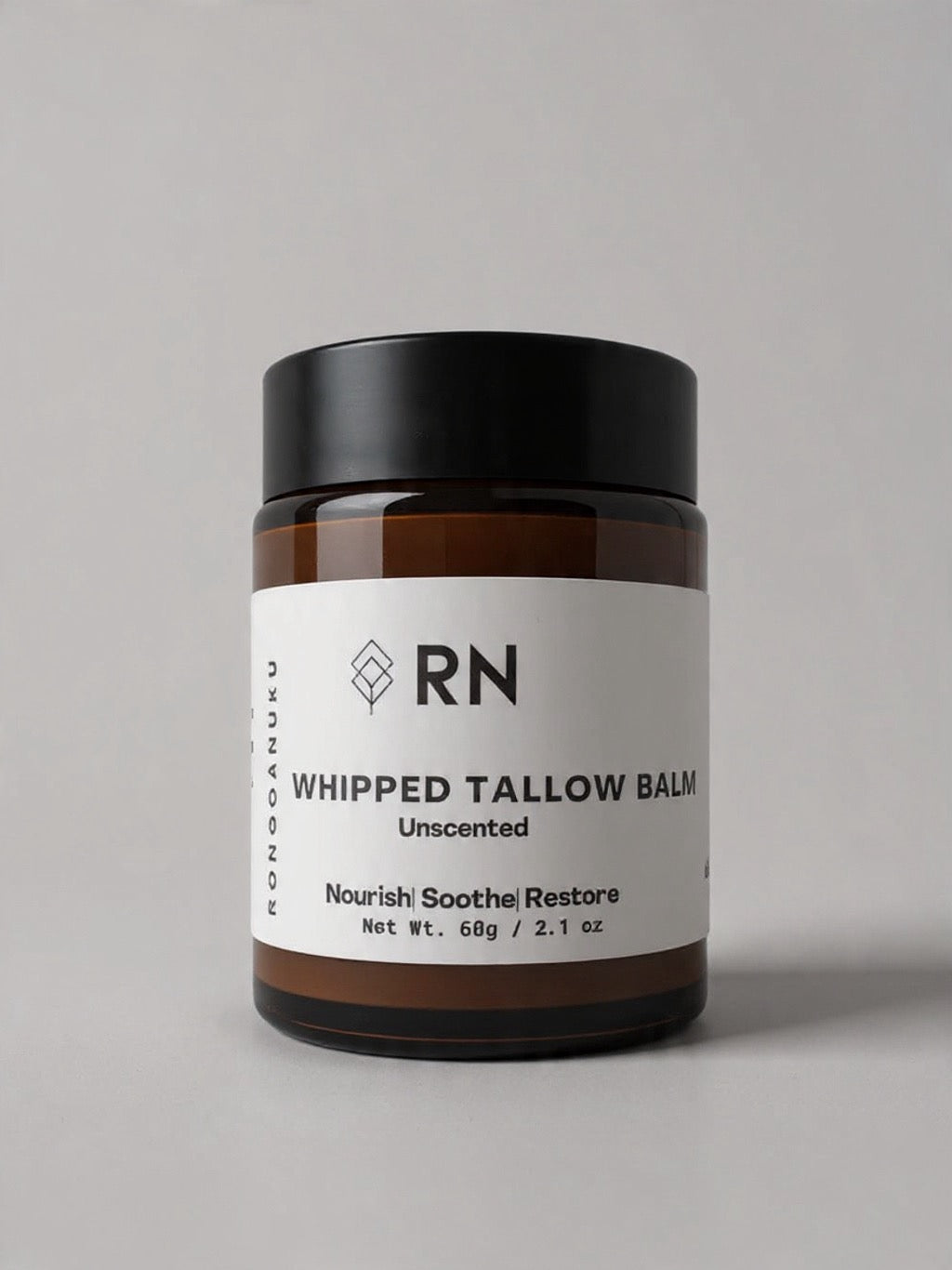 Unscented 60g amber jar of whipped tallow balm with white product label