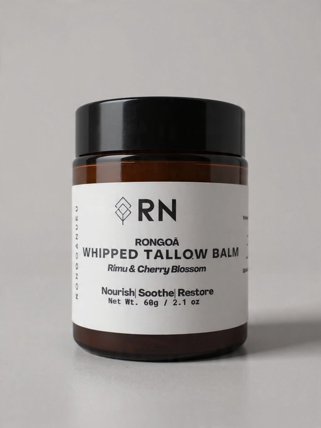 60g amber jar of Cherry Blossom and Rimu whipped tallow balm with a white product label