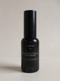 Wharepaku toilet deodoriser spray in 30ml travel size sleek black glass bottle, designed to spray into toilet water before use to prevent odours.