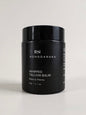 Black jar of Rongoanuku whipped tallow balm with rimu & peony on a light background