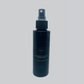 Sleek black spray bottle of wharepaku deodoriser 120ml